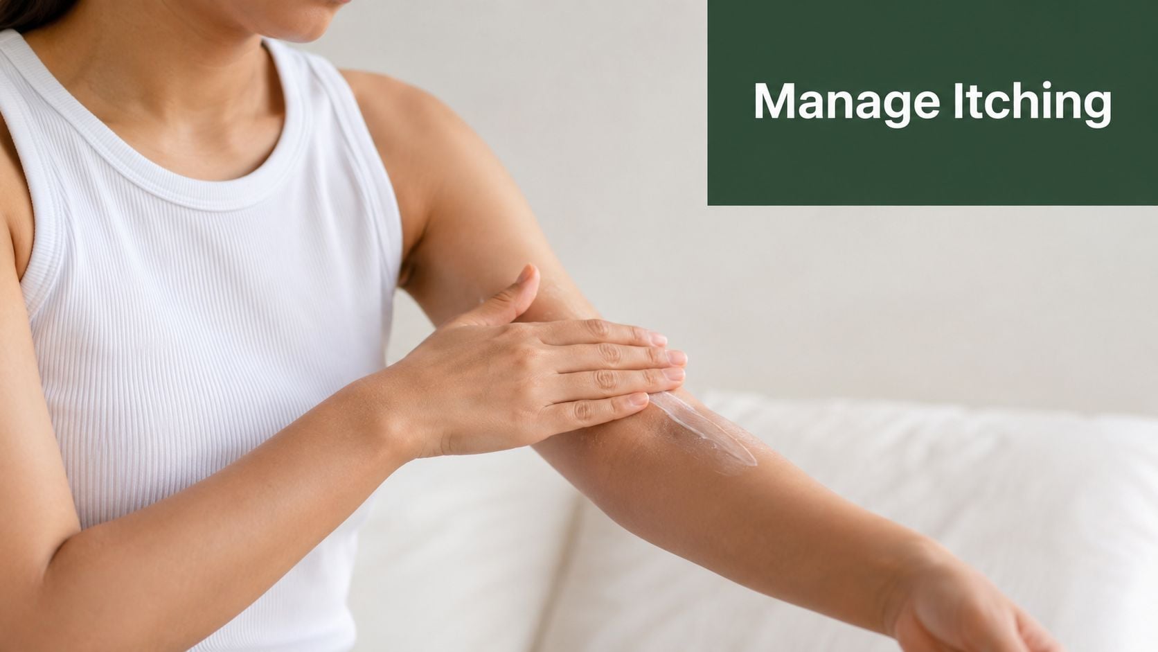 A woman applying moisturizing cream to her arm to help manage skin itching and discomfort.