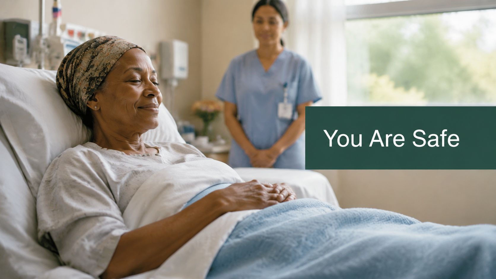 A smiling patient in a hospital bed with a nurse standing supportively in the background.
